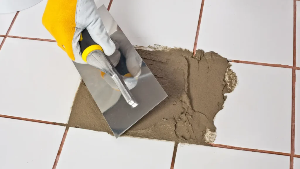 Remove Affected Tiles From the Shower Floor and Repair